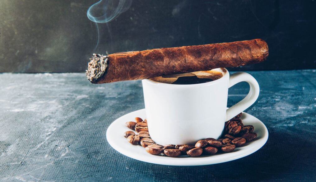 Cup,Of,Coffee,,Coffee,Beans,,Ashtray,With,Cigar,On,Dark